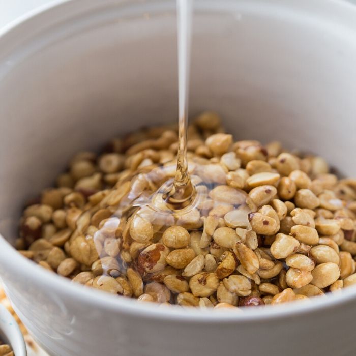 Peanut brittle is a classic holiday treat. Make this microwave peanut brittle today! Just a few ingredients, quick cook time, and a tasty Christmas recipe. #christmas #peanutbrittle #easy #microwave #rawpeanuts #cornsyrup #holiday #recipe homemade peanut brittle