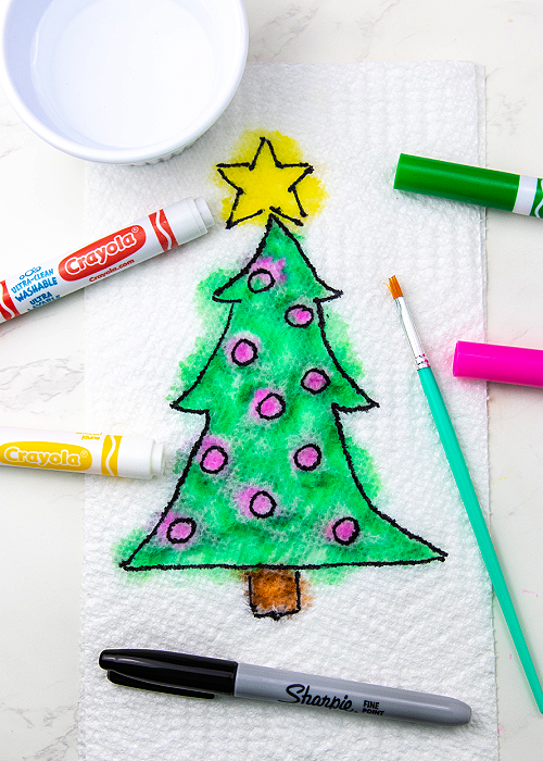 a christmas tree painted on a paper towel