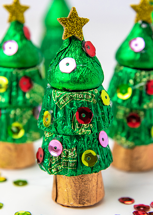 a christmas candy tree made out of hershey kisses and rolos