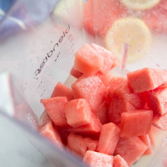 Frozen Watermelon Lemonade is so easy to make! I used a homemade lemonade but you are welcome to use store bought for these watermelon lemonade slushies. #watermelon #slush #slushies #lemonade #homemade #frozen #summerdrink #easy #partydrink watermelon lemonade in blender