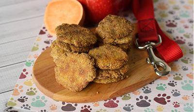 Sweet potatoes and apples are some of my favorite foods so it makes sense my dog loves them, too! When the kids and I make these dog treats, I roll them into balls and they "squish" them and place them onto the baking sheet. This causes for lots of laughs and giggles and funny sounds of squishing the dough. We always have fun making these. If you don't want to roll your treats into balls and squish them, you can always flatten them into a pan (use your fingers) and cut them with a pizza cutter or sharp knife before baking them. And depending on the thickness of your dough, you may have to put them in for a shorter or longer baking time. Check after 20 minutes to make sure they aren't burning. I'm certain your pooch will love these homemade dog treats as much as I do!