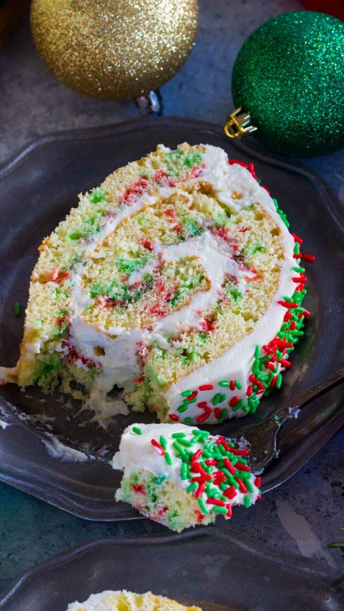 This Funfetti Christmas Cake Roll Recipe is the perfect Holiday Dessert or Treat for your friends and family! Plus, it's easy to make for the holidays!