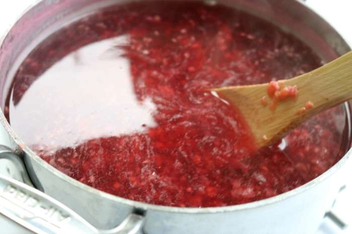 Raspberry Iced Tea Recipe! An easy summertime homemade and refreshing Iced Tea recipe for pool parties, BBQs, backyard grilling, or family get-togethers! #tea #homemade #fruit #raspberry #icedtea #drink #recipe #fresh #crowdworthy Cooked Raspberries for Tea