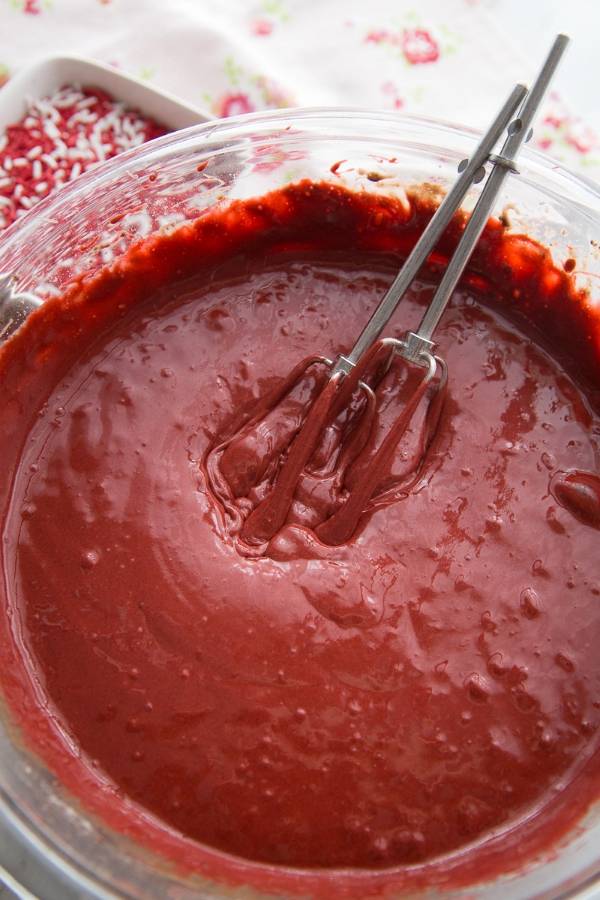 Serve up this always popular red velvet cake roll for any upcoming occasion. This red velvet cake roll uses a box cake mix for easy prep. #box #easy #cakmix #homemadefrosting #best #dessert #powderedsugar #baking #sweets red velvet cake roll made with cake mix