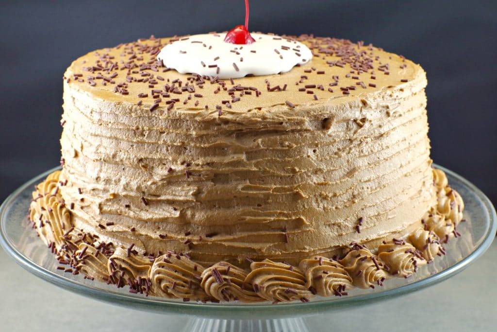 root beer float on a cake stand
