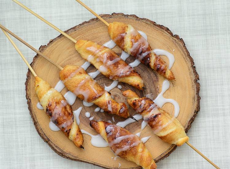 campfire cinnamon rolls on a stick