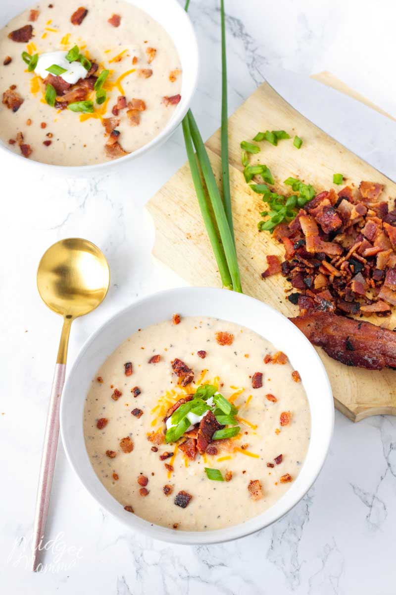low carb bacon cauliflower soup in a bowl on table