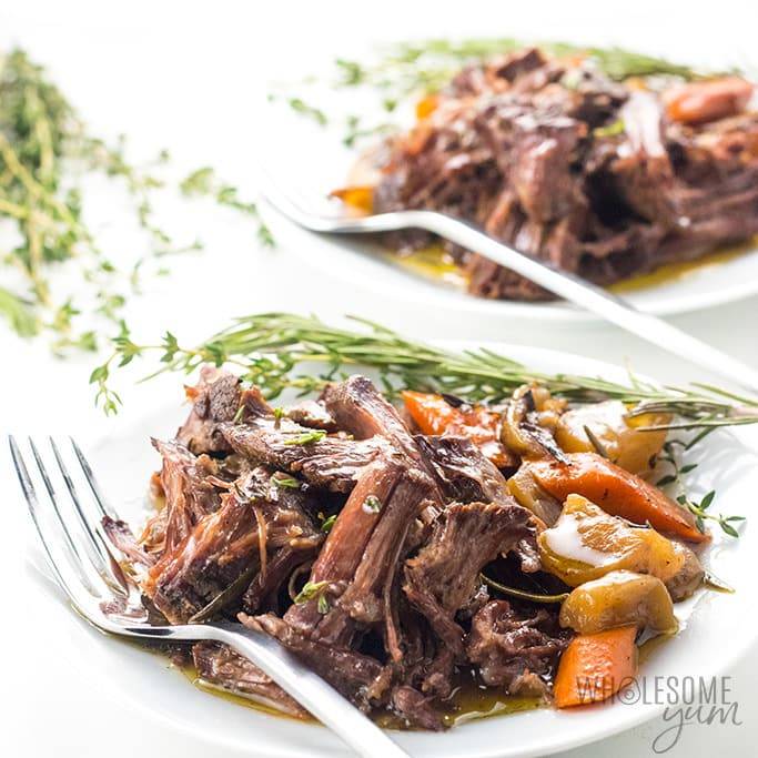 pot roast on a plate with fork by it 