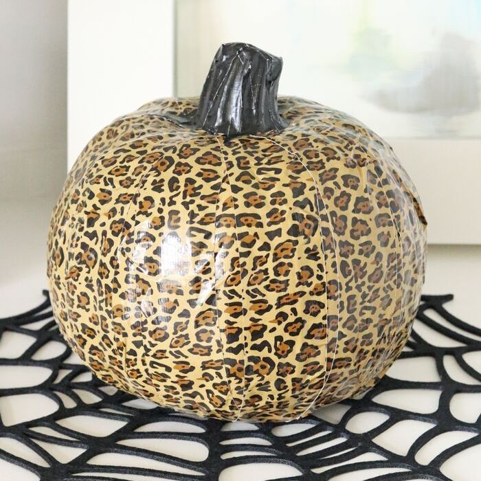 Check out this easy faux leopard print pumpkin. This duct tape pumpkin craft is so simple to make but adds tons of color to a room! #leopard #halloween #fall #craft #fauxpumpkin #ducttape #craft #diy #project #homedecor duct tape pumpkin