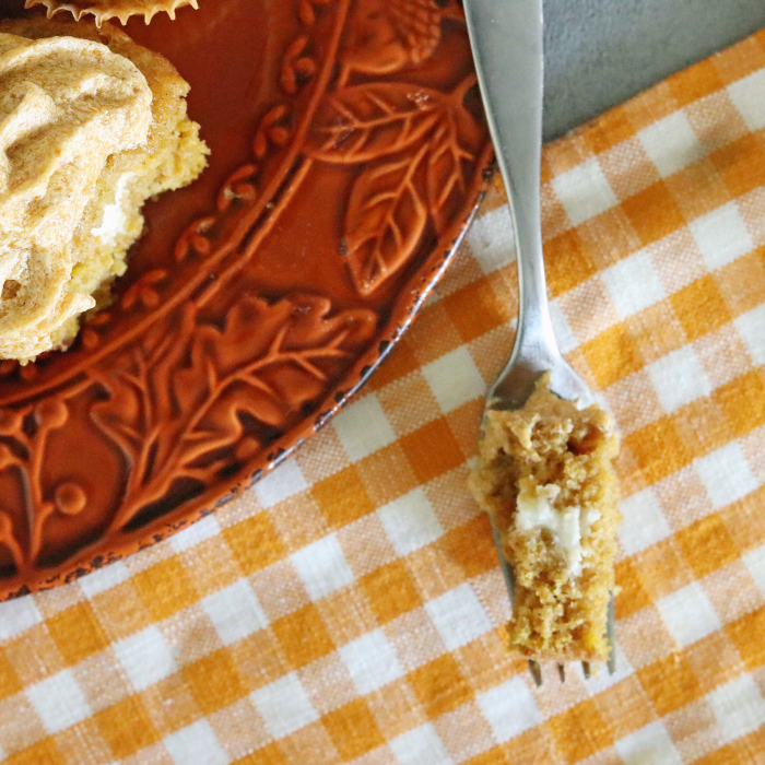 Pumpkin roll cupcakes are a must make for fall. Light and tender pumpkin cupcake with a cream cheese filling and topped with pumpkin spice frosting. frosting pumpkin cupcakes