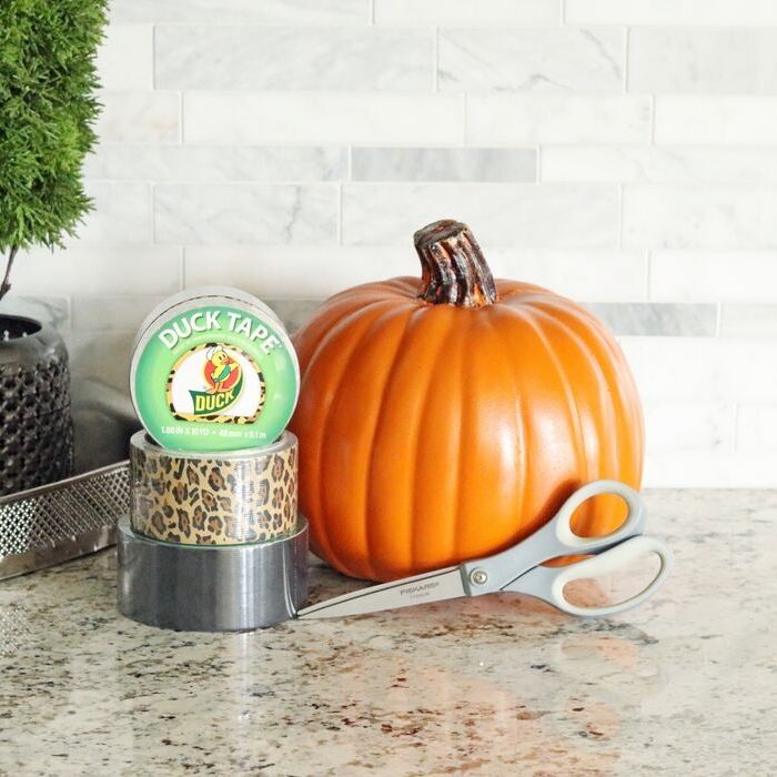Check out this easy faux leopard print pumpkin. This duct tape pumpkin craft is so simple to make but adds tons of color to a room! #leopard #halloween #fall #craft #fauxpumpkin #ducttape #craft #diy #project #homedecor pumpkin craft