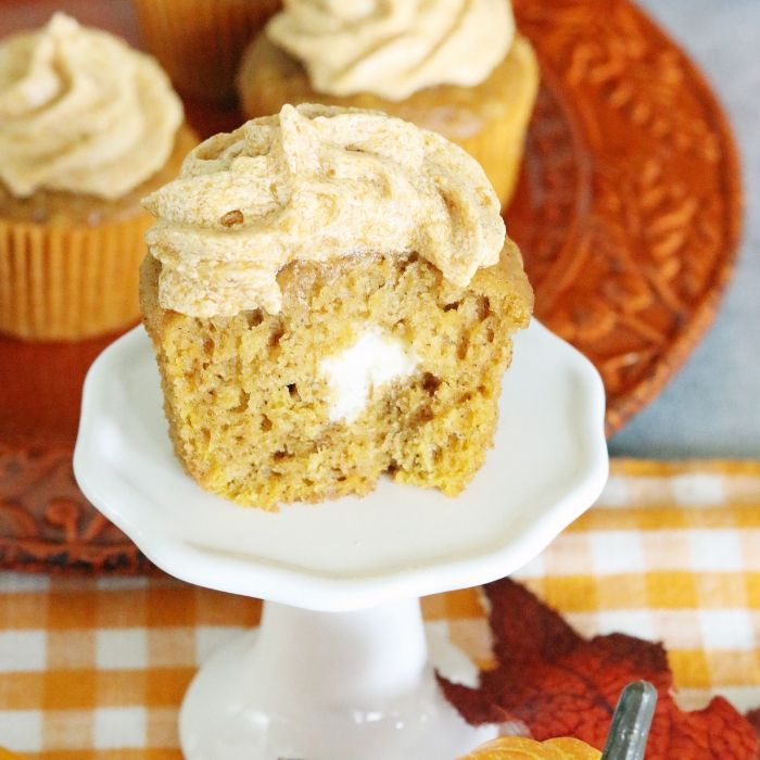 Pumpkin roll cupcakes are a must make for fall. Light and tender pumpkin cupcake with a cream cheese filling and topped with pumpkin spice frosting. pumpkin roll cupcake recipe
