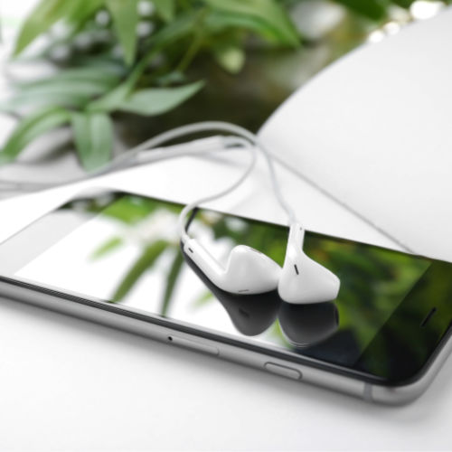 Audible Free Trial - cell phone and earbuds