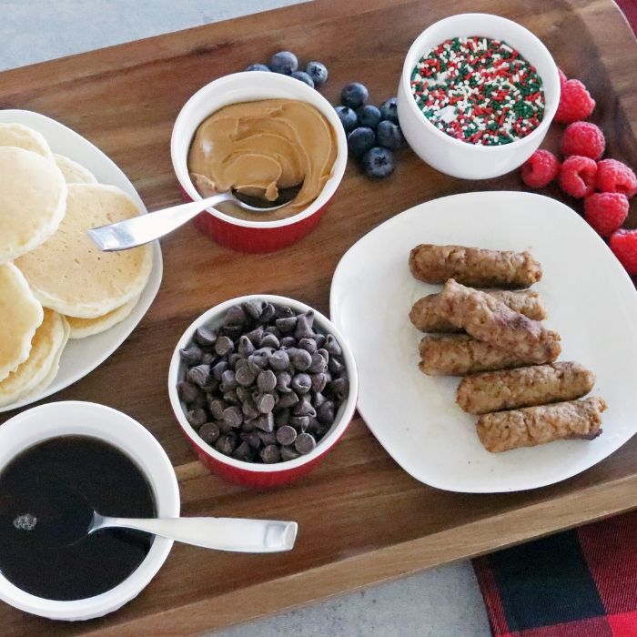This breakfast board is the perfect Christmas breakfast idea. A platter loaded with incredible breakfast items with a fun holiday twist. #Christmas #holiday #breakfast #recipe #idea #platter #tray #foracrowd #morning #easy #best breakfast platter