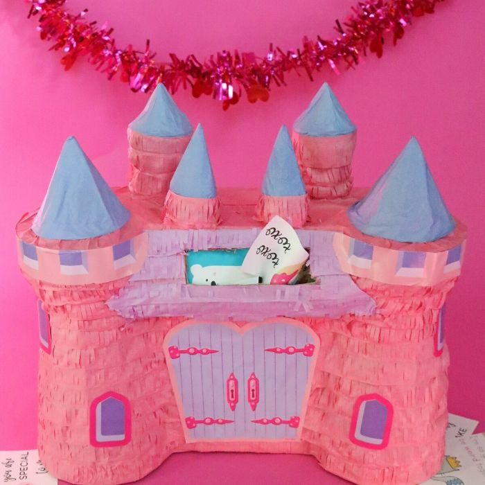 Learn how to make a Valentine Box out of a Pinata! This is a quick and easy way to really make a fun and colorful Valentine's Day box in just a minute or two. #passion4savings #pinata #howto #make #valentinebox #diy #easy #valentinesday #forkids #fun #easy #craft castle valentine box