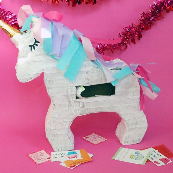 Learn how to make a Valentine Box out of a Pinata! This is a quick and easy way to really make a fun and colorful Valentine's Day box in just a minute or two. #passion4savings #pinata #howto #make #valentinebox #diy #easy #valentinesday #forkids #fun #easy #craft unicorn valentine box