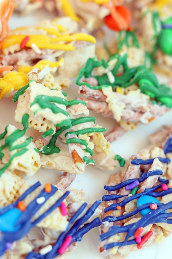 This Rainbow Trash Recipe is a perfect mix of sweet and salty in every bite. Raid your pantry for all the ingredients needed in this colorful candy trash recipe. #rainbow #sweet #salty #passion4savings #dessert #stpatricksday #ideas #forkids #fun #nobake rainbow trash recipe idea