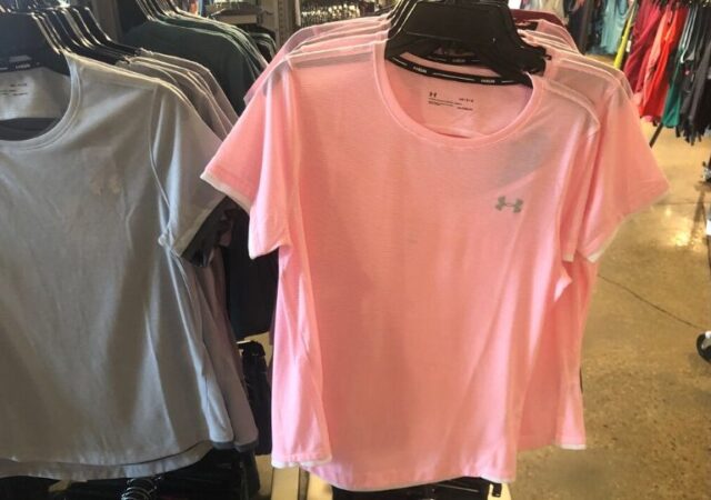 Under Armour Girl’s Shirts On Sale - shirt hanging in store