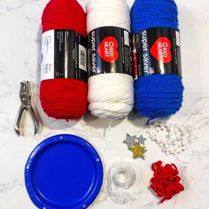 Patriotic Dream Catcher Craft for Kids is the perfect 4th of July kids craft to consider making. Grab some supplies and create a fun and patriotic colored homemade dream catcher. #passion4savings #craft #forkids #patriotic #4thofjuly #diy #fun #Paperplate #crafting paper plate dream catcher