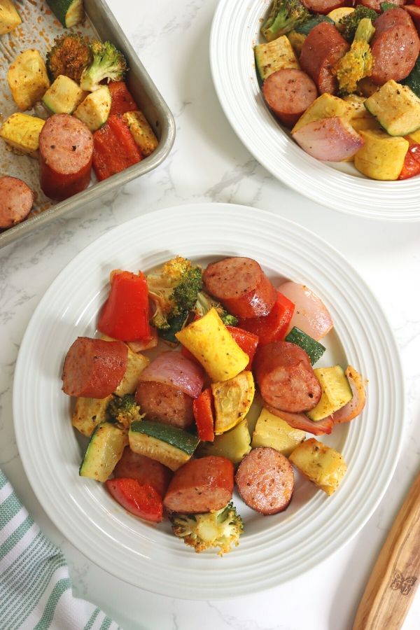 sausage and vegetables on a white plate 