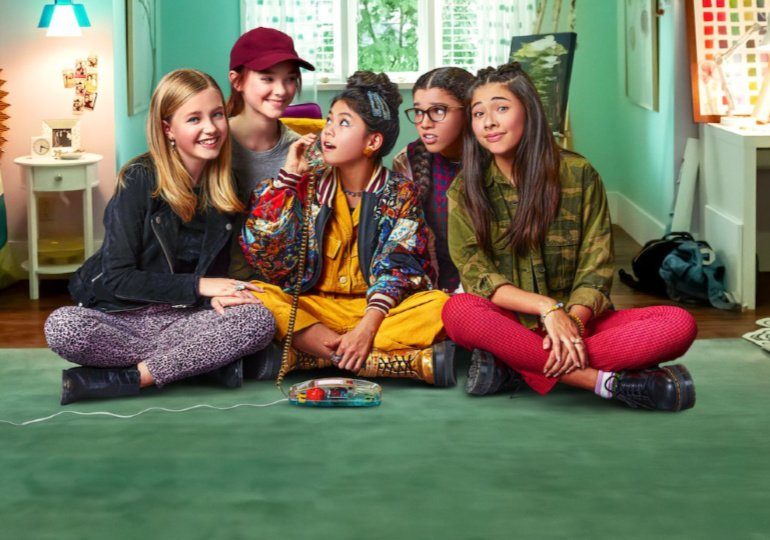 The Baby-Sitters Club is Coming to Netflix - Cast of Baby-Sitters Club gathered around the phone