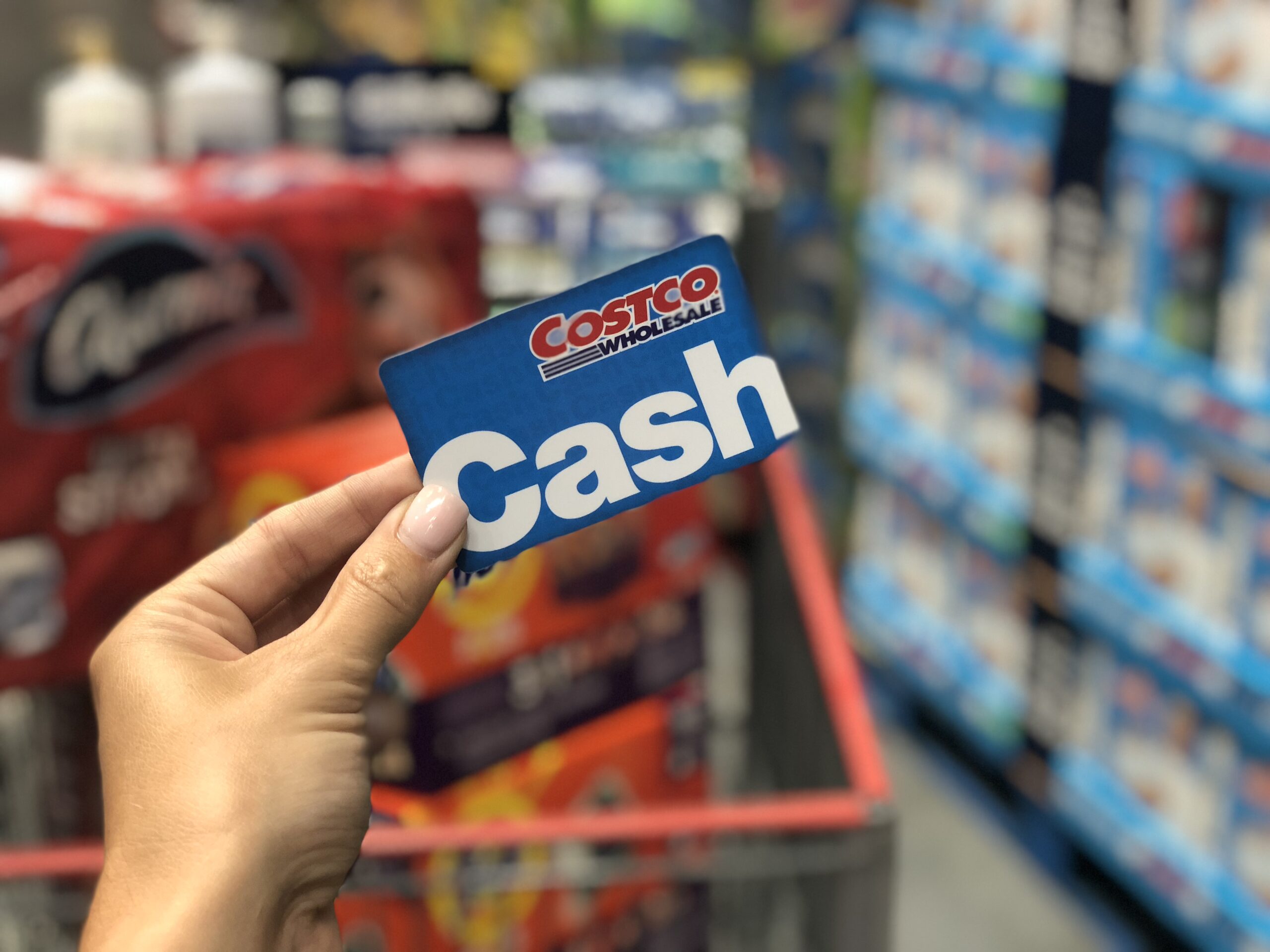 Costco Membership Deals - holding cash card