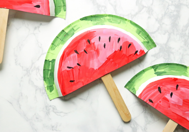 craft idea for kids - watermelon paper plate fans on table