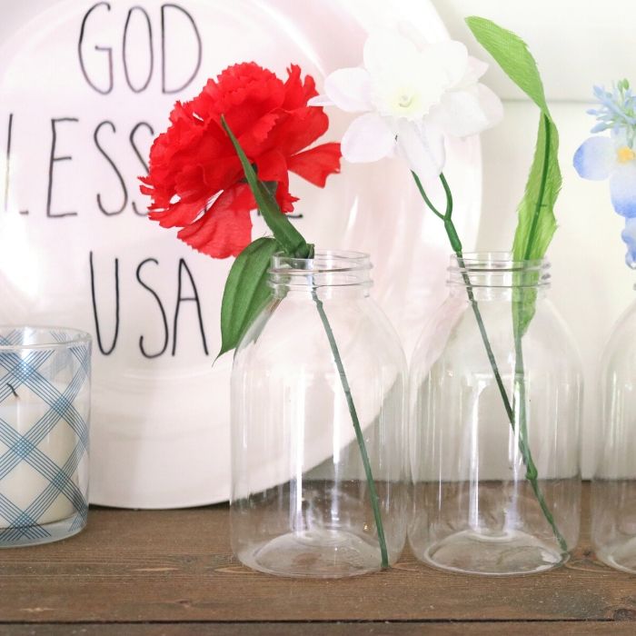 Check out these Patriotic Dollar Tree Decor Ideas to transform your space today! These are some great ideas to dress up your home on a budget. #patriotic #4thofjuly #dollartree #budget #affordable #patriotic #memorialday #passion4savings flowers in a vase