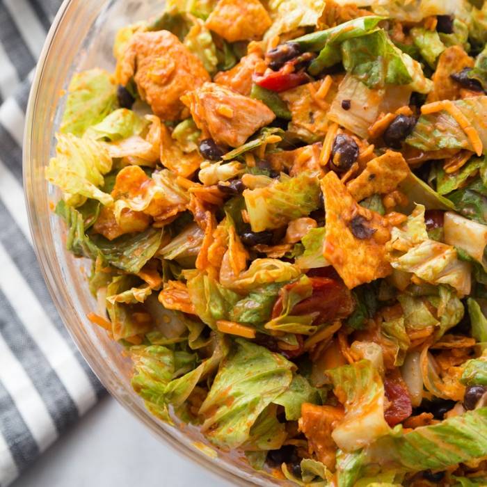 dorito taco salad in a bowl with towel by it 