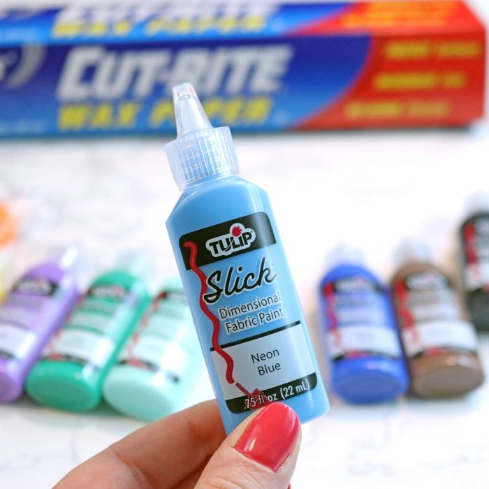 tulip puff paint with wax paper behind it 