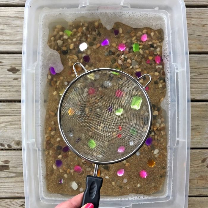 panning for jems with in a plastic container