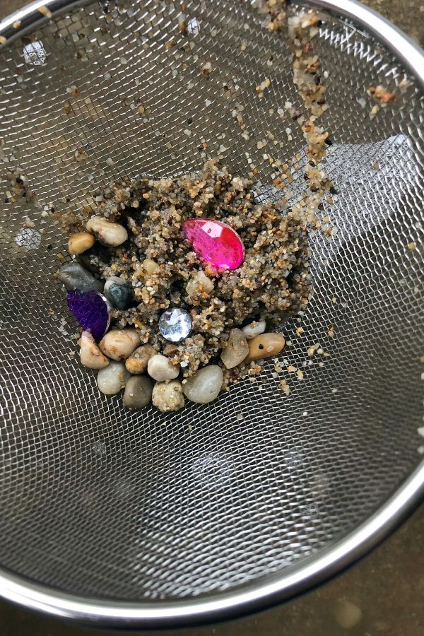 rocks and gems in fine mess strainer
