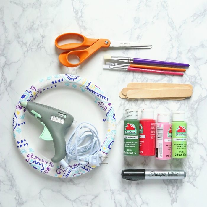 paper plate craft with all the supplies on marble counter