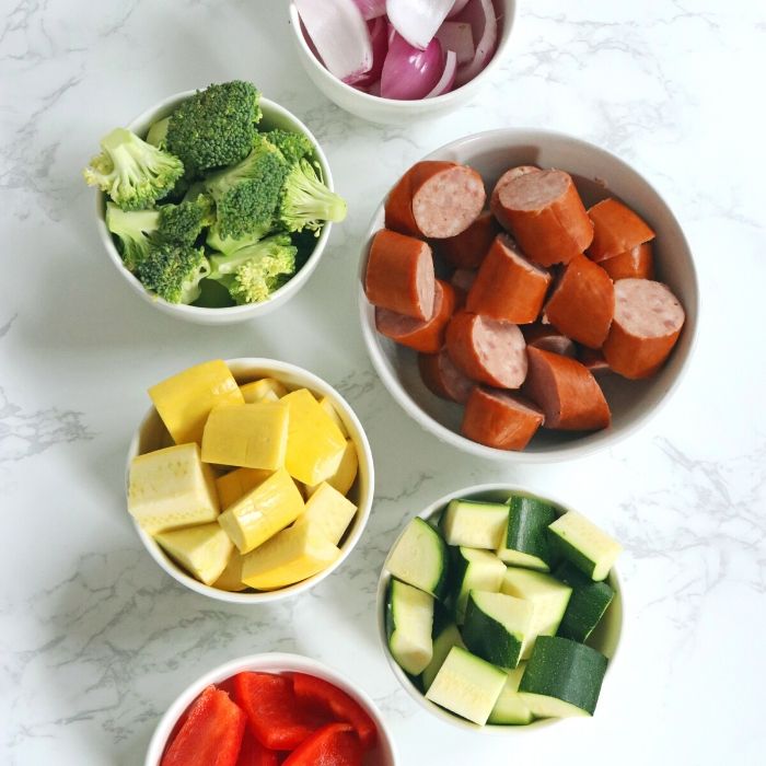 smoked sausage and veggies all in a bowl 