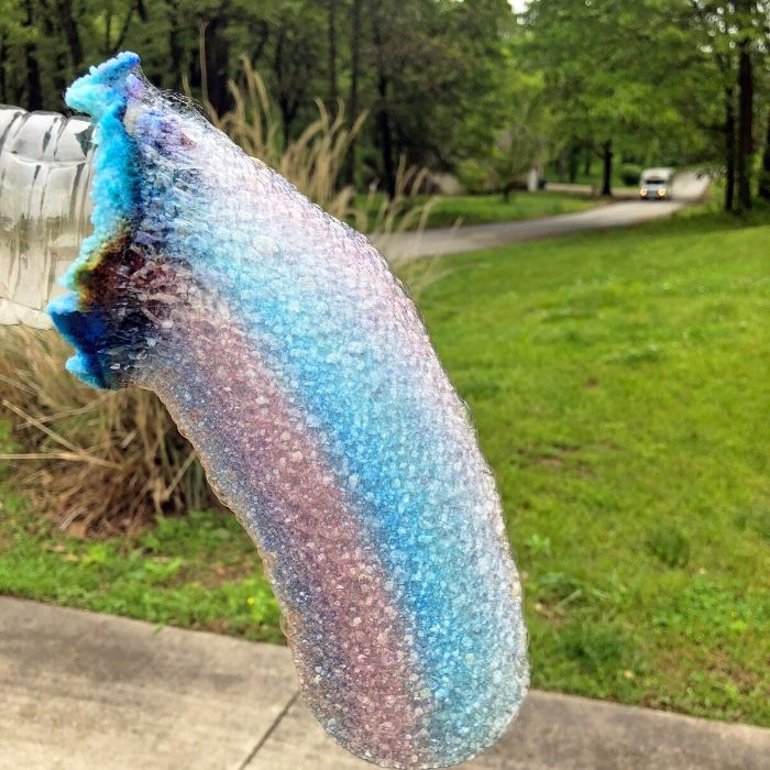 blowing bubbles through bottle 