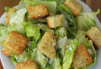 caesar salad on a white plate