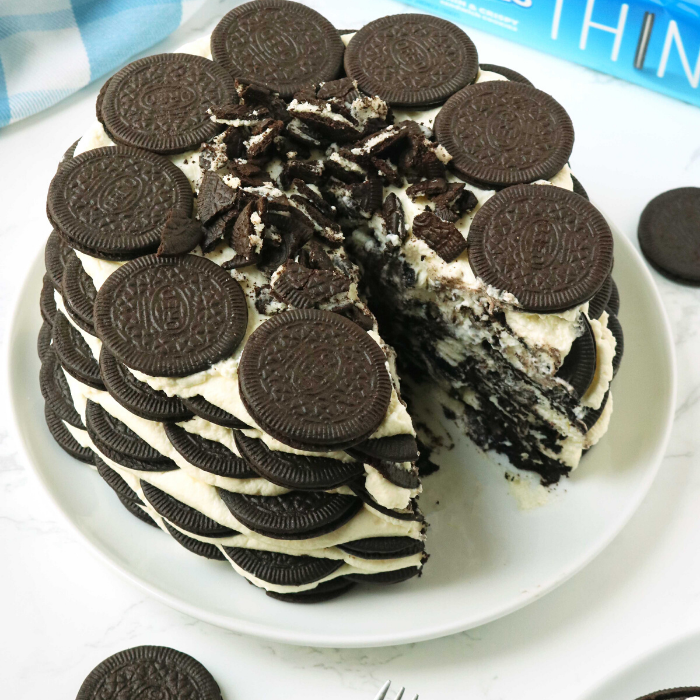 oreo icebox cake with slice cut out on white plate