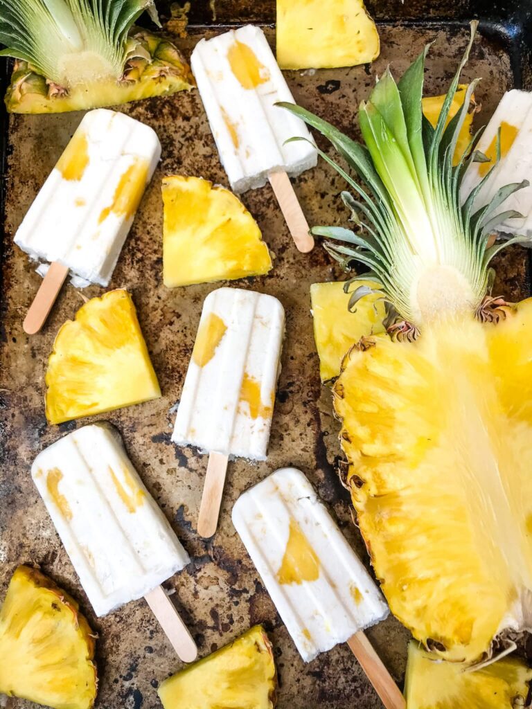 pina colada popsicles with pineapple by it 
