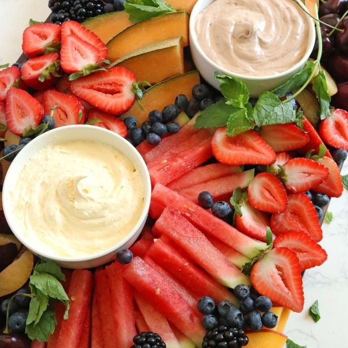 fruit board with fresh fruit and fruit dips 