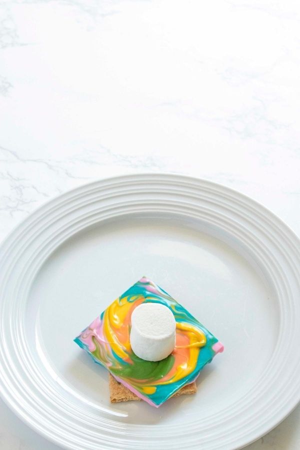 start of making smores on white plate