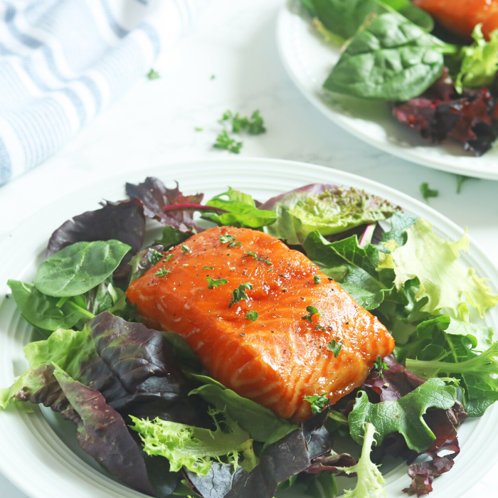 salmon on top of greens 