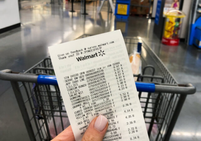 Walmart Savings Hacks - Holding a Walmart receipt