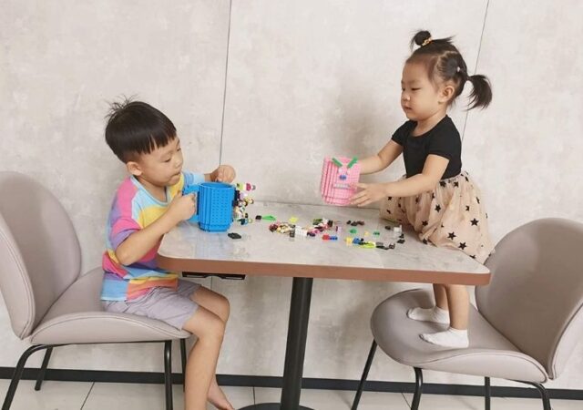 Build-On-Brick Mug - kids playing with brick mug