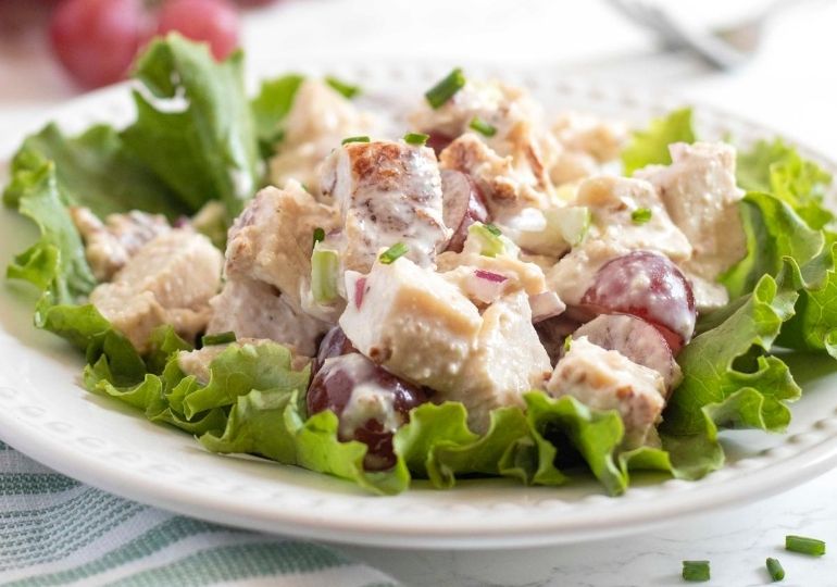 plate of chicken salad with grapes