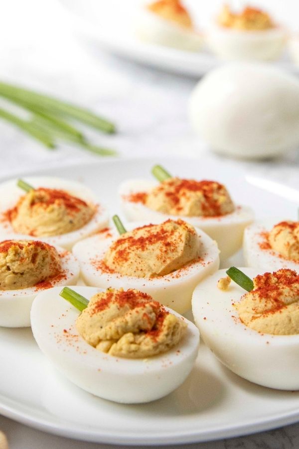 holiday deviled eggs on platter on table 