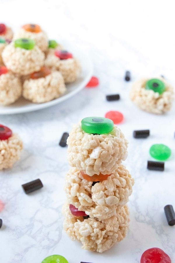 halloween rice krispies stacked up on a table 