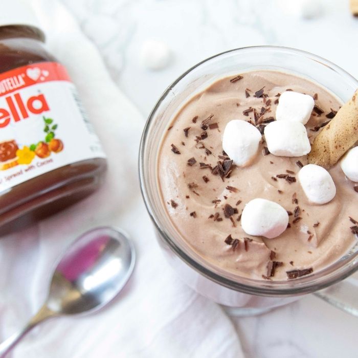 hot chocolate and Nutella on marble table 