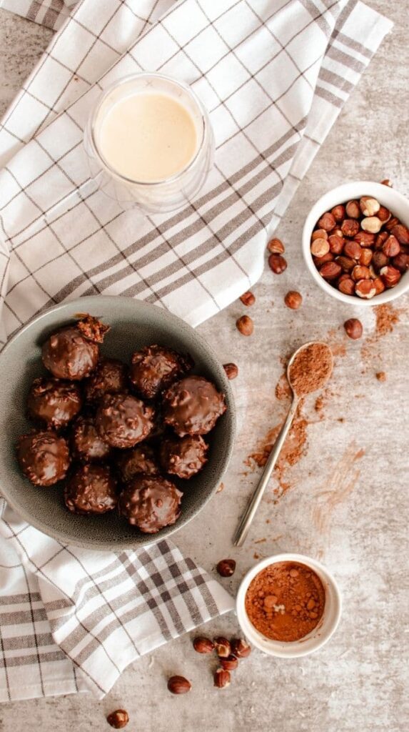 chocolate protein balls in a bowl 