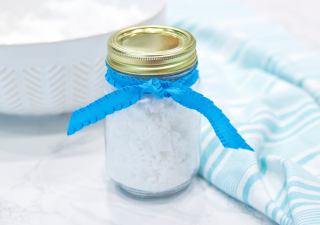 jar of fake snow with ribbon on top
