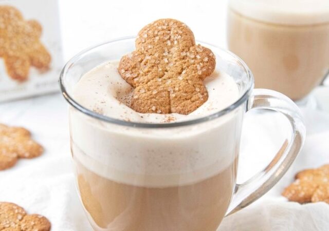 gingerbread hot drink on table in a clear cup